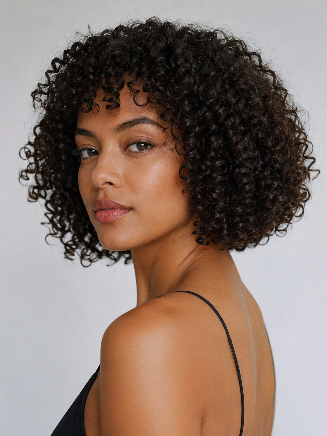 tight curl bob with defined tight curls and balanced bob length