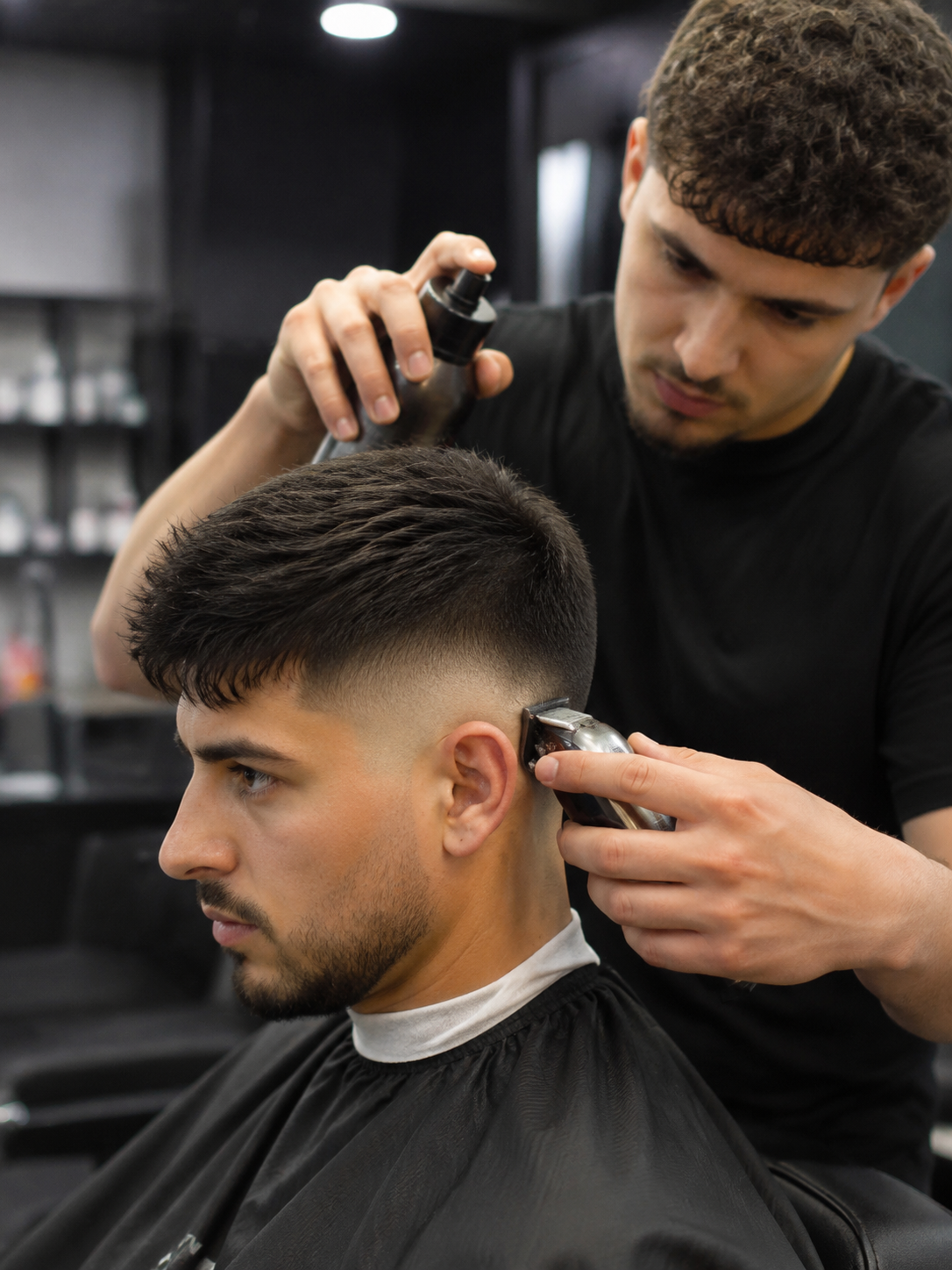 styling mid fade haircut at the barber