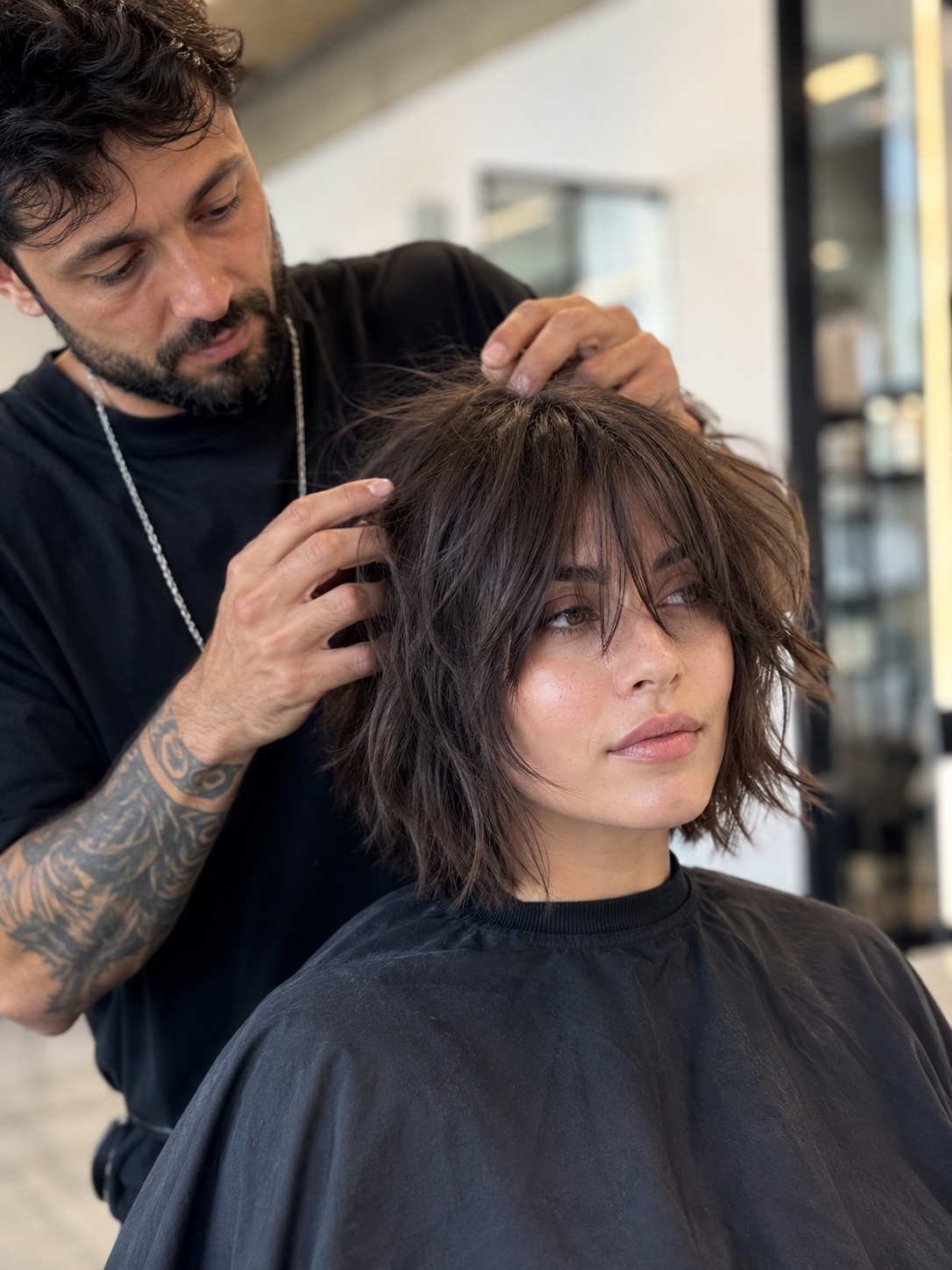 styling a shaggy bob haircut with texture spray and finger separation