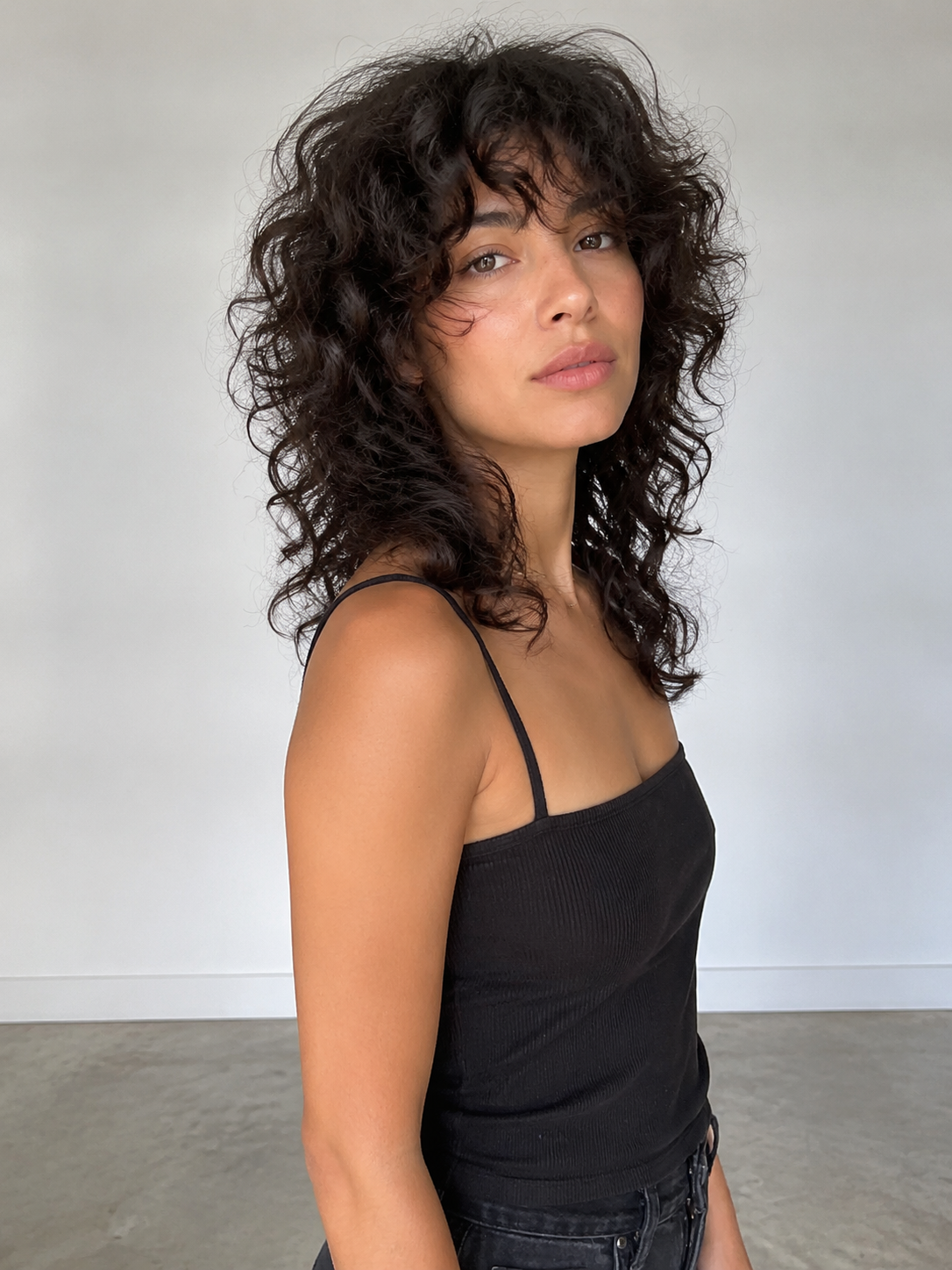 curly wolf cut with shaped crown volume